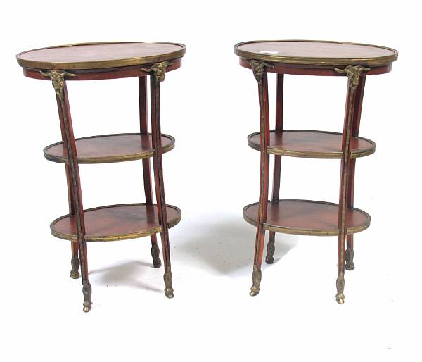 Appraisal: A pair of Empire style oval three tier tables with