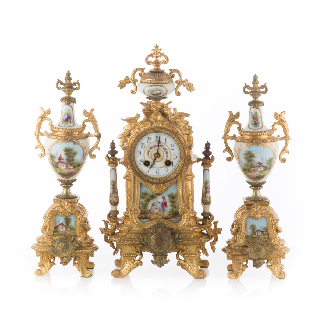 Appraisal: Napoleon III gilt-metal clock garniture circa clock with gilt-metal case