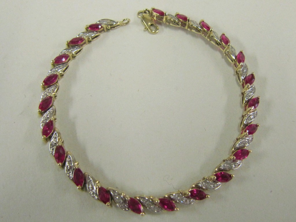 Appraisal: Ten carat bi colour gold ruby and diamond set line