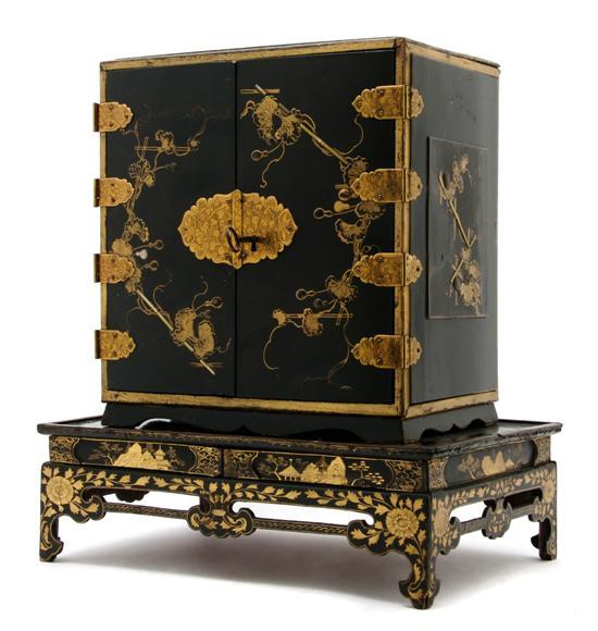 Appraisal: Chinese Black Lacquered Diminutive Cabinet on Stand having two paneled