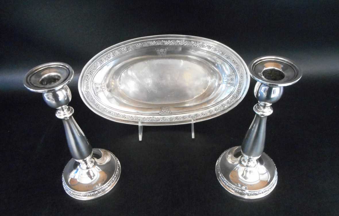 Appraisal: THREE STERLING SILVER TABLEWARE ITEMS pair International Silver Prelude candlesticks