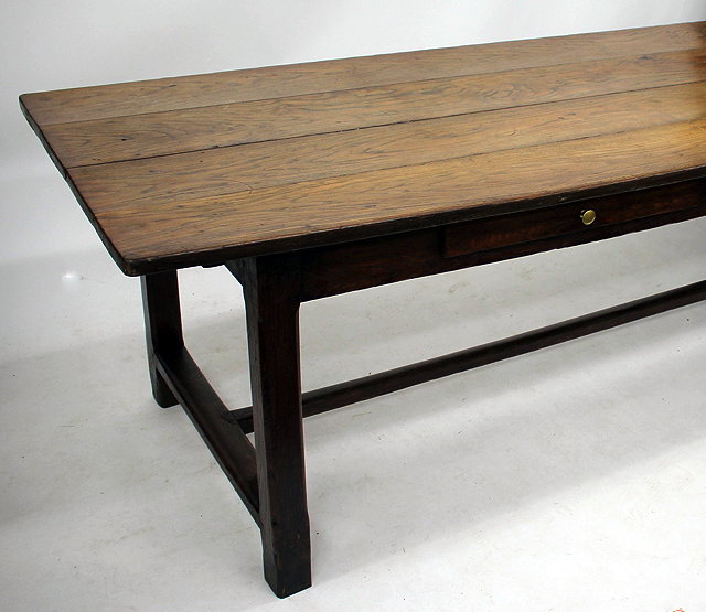 Appraisal: A LARGE OAK FARMHOUSE TABLE the planked top with single