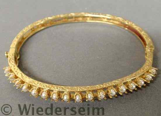 Appraisal: Victorian k yellow gold and pearl bangle bracelet with engraved