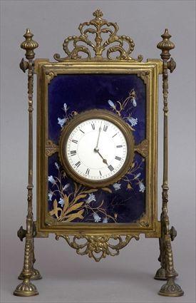 Appraisal: AESTHETIC MOVEMENT GILT-METAL AND PORCELAIN MANTLE CLOCK The enamel dial