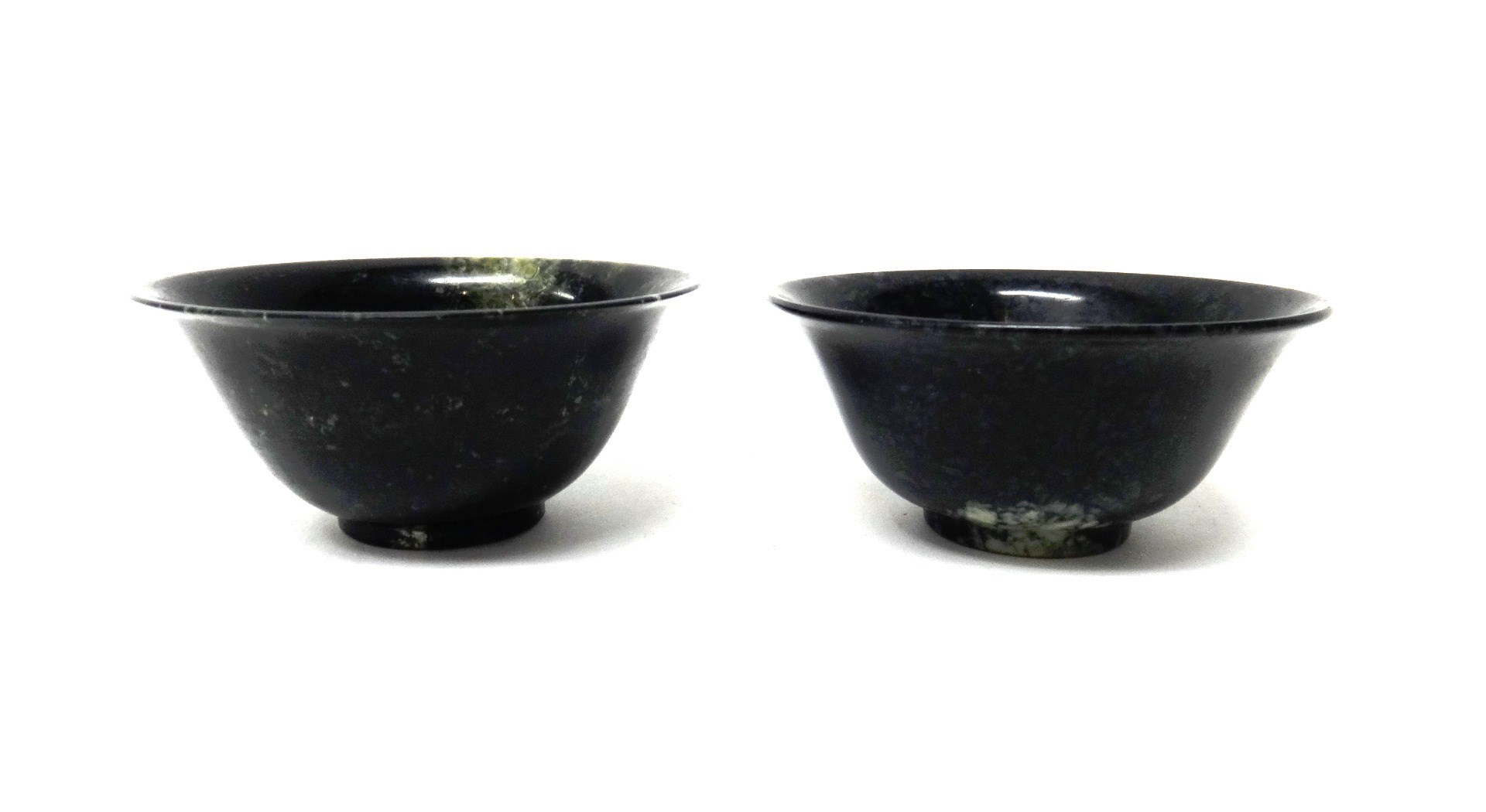 Appraisal: A pair of Chinese hardstone bowls with green and cream