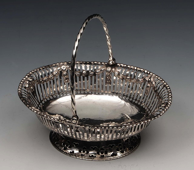 Appraisal: A GEORGE III SILVER OVAL SWEETMEAT BASKET with pierced sides