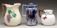 Appraisal: THREE ANTIQUE PITCHERS - h Majolica water pitcher having a