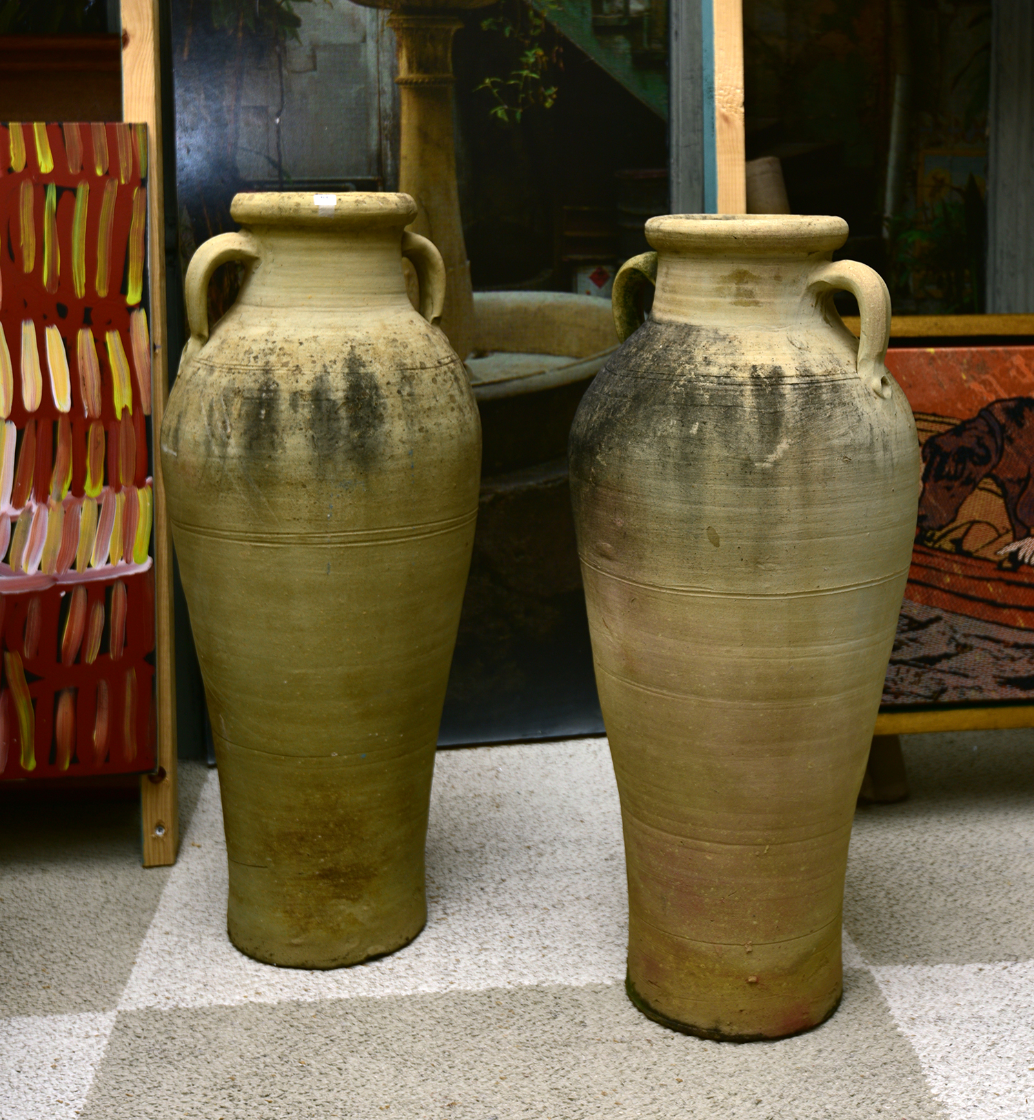 Appraisal: A PAIR OF EARTHENWARE TWO HANDLED URNS WITH SPATTER FINISH