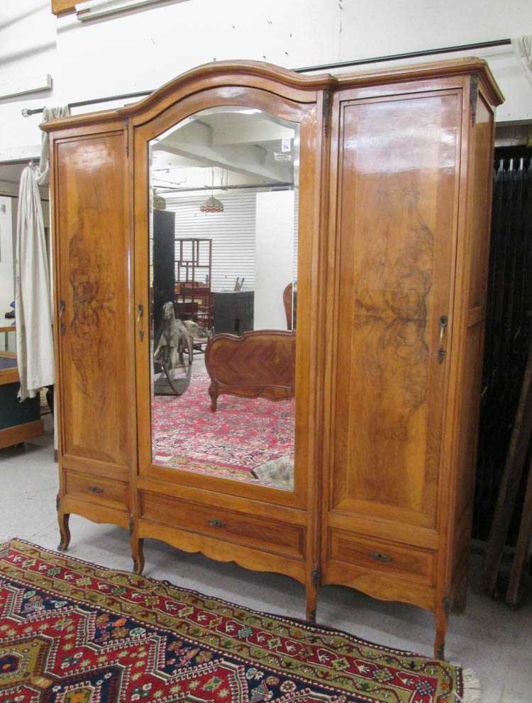 Appraisal: LOUIS XV STYLE THREE-DOOR WARDROBE Continental c walnut and burl