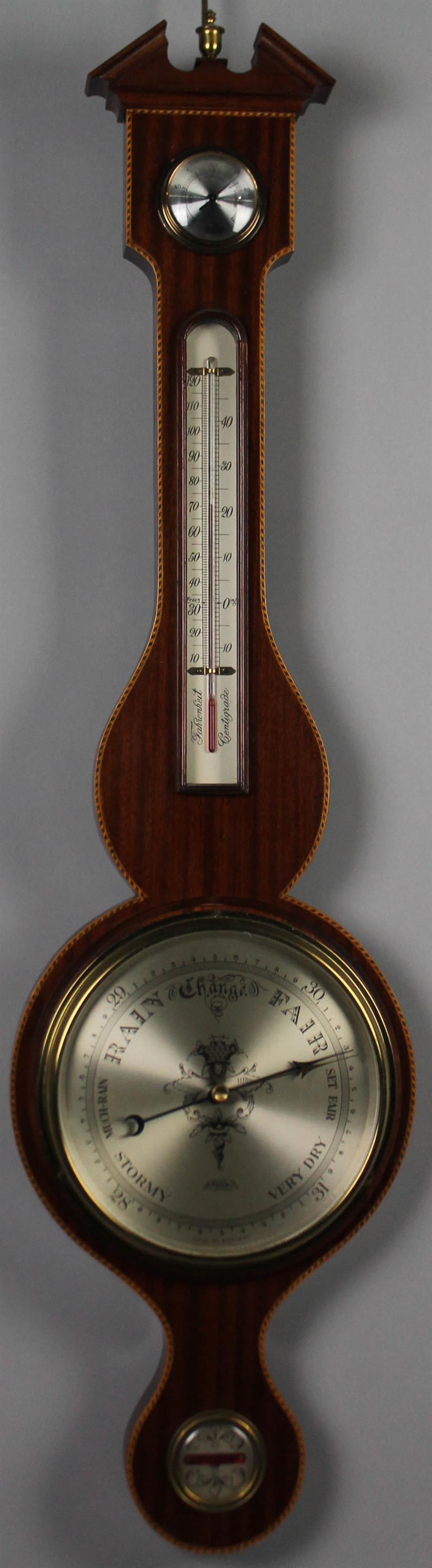 Appraisal: GEORGIAN STYLE INLAID MAHOGANY BAROMETER having a broken arch pediment