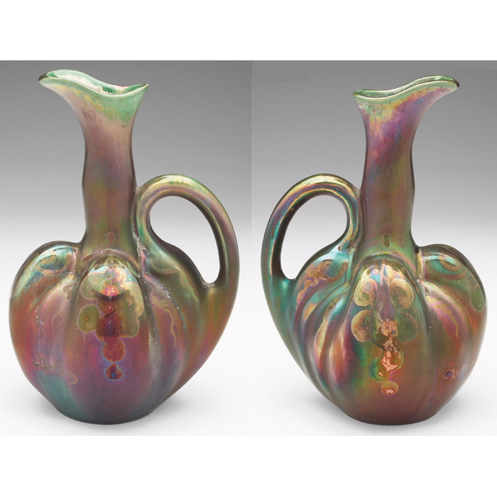 Appraisal: Montieres handled vessel organic shape covered in a colorfulmetallic glaze