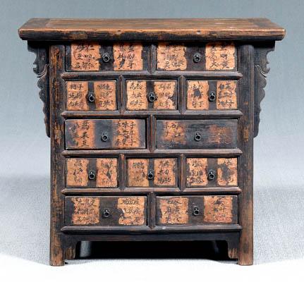 Appraisal: Chinese apothecary cabinet lacquered mortise-and-tenon construction drawers with coin and