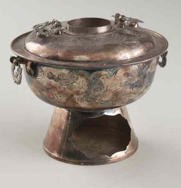 Appraisal: Chinese silver hot potdepicting phoenix and plum blossoms ''H x