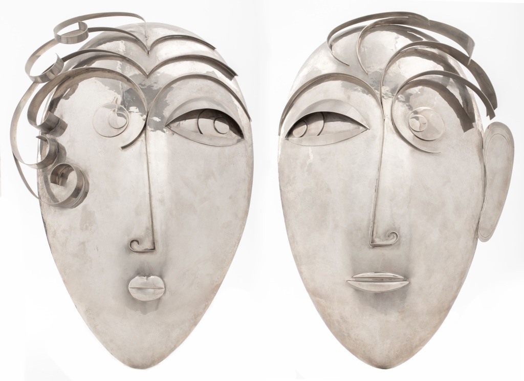 Appraisal: FRANZ HAGENAUER ART DECO CHROMED METAL MASKS PAIR Pair of