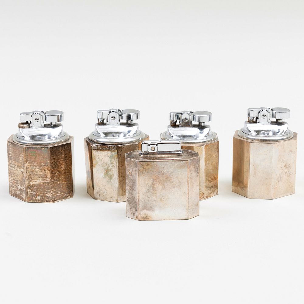 Appraisal: Group of Four Cartier Silver Table Lighters Each marked 'Sterling'