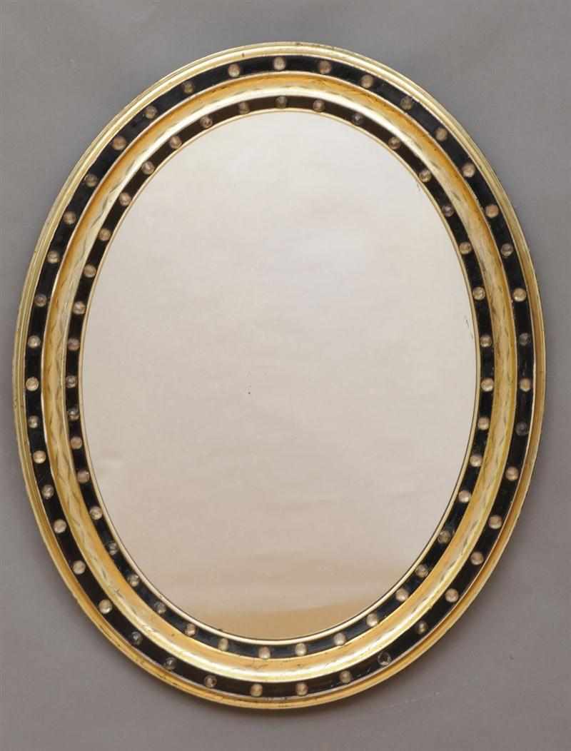 Appraisal: TWO SIMILAR IRISH REGENCY GILTWOOD AND EBONIZED OVAL MIRRORS Each