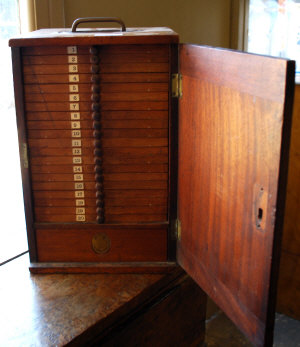 Appraisal: Victorian mahogany travelling coin collector's cabinet with campaign fittings having