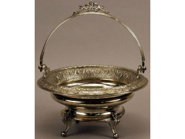 Appraisal: Quality quad plated handled bowl with fine relief rim sitting