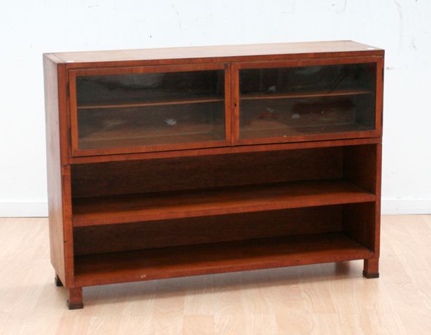 Appraisal: A pine open bookshelf with two glazed compartments cms wide