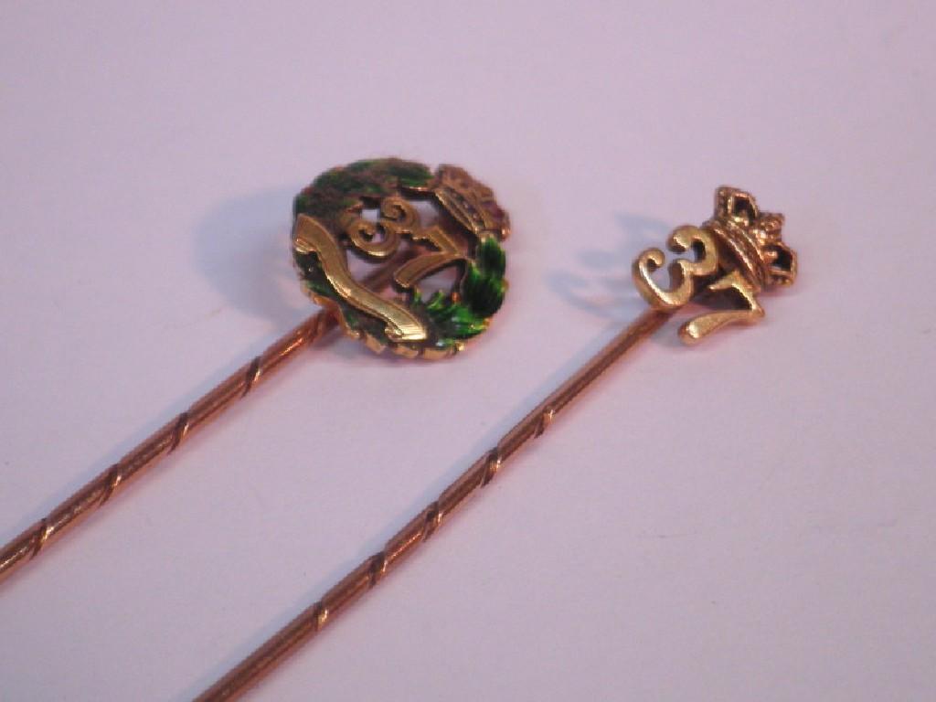 Appraisal: Two stick pins displaying and a crown possibly army related