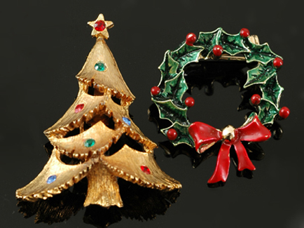 Appraisal: Two costume Christmas brooches A mulit-coloured paste set Christmas tree