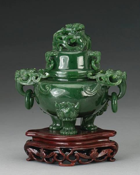 Appraisal: A small 'spinach' jade covered censer th Century Raised on