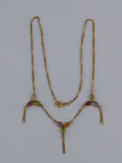 Appraisal: A yellow metal tests carat gold gem set necklace approx