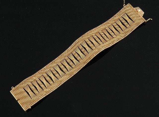 Appraisal: A GOLD COCKTAIL BRACELET The finely woven ct gold bracelet