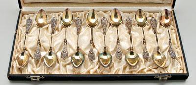 Appraisal: Twelve gilt silver demitasse spoons shield handles with faces fleur