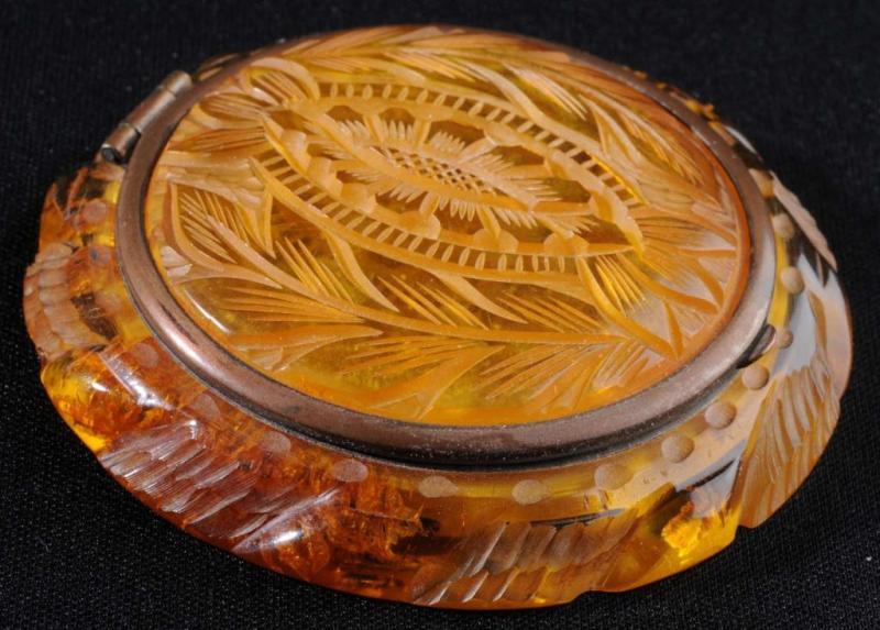 Appraisal: Bakelite Carved Apple Juice Compact Description Mirror has a bit