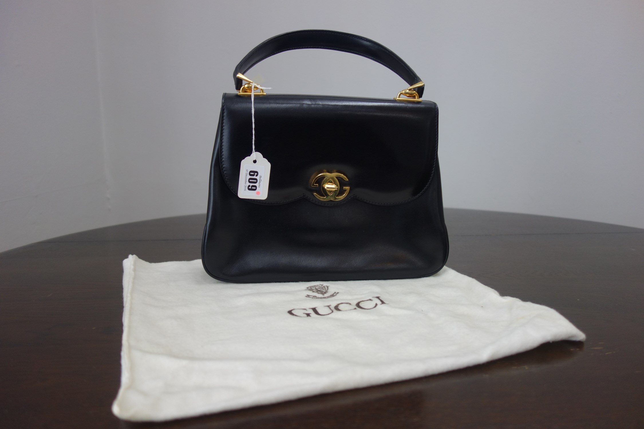 Appraisal: Gucci a lady's black leather handbag with gilt double 'G'