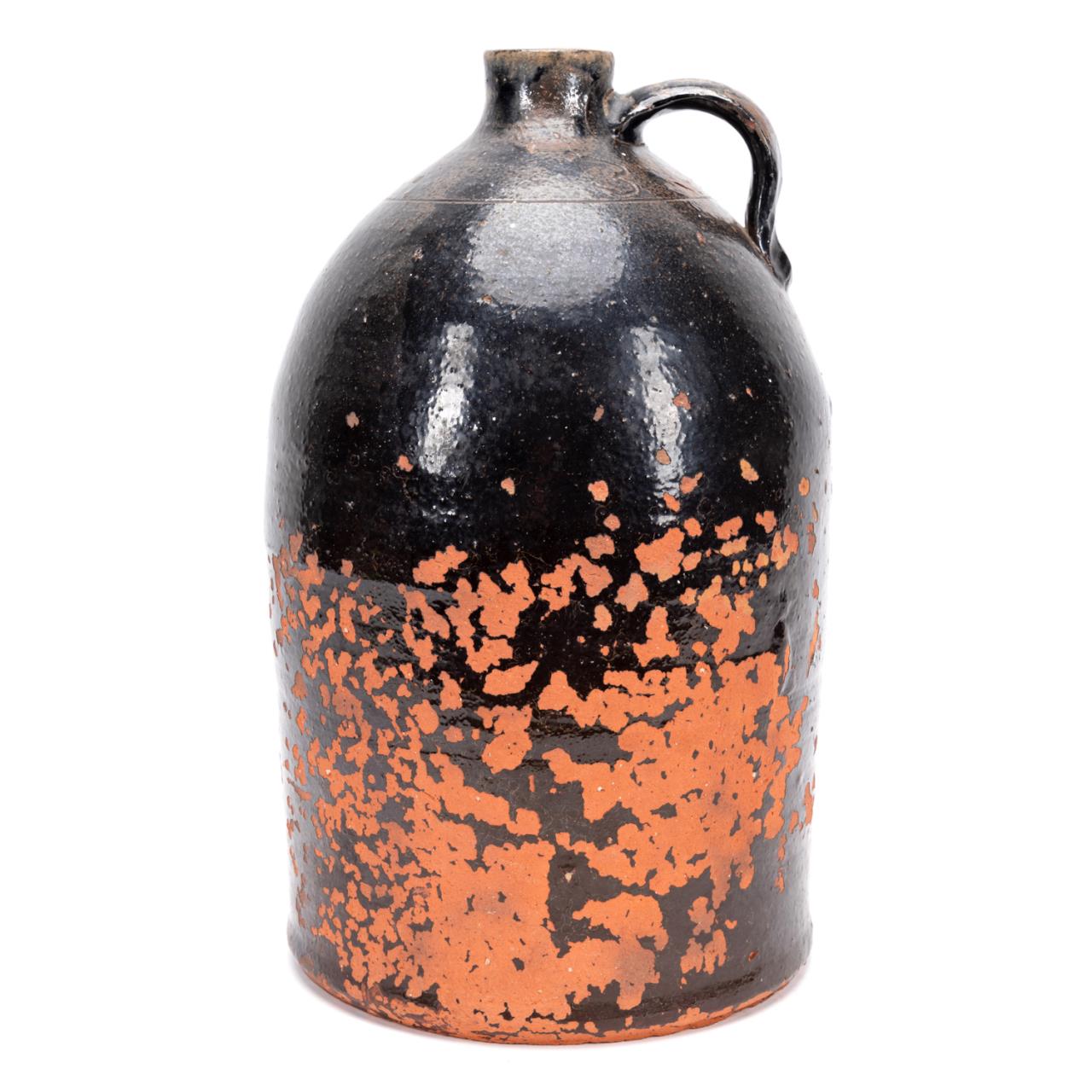 Appraisal: AMERICAN BEEHIVE FORM BLACK GLAZE POTTERY JUG American three gallon