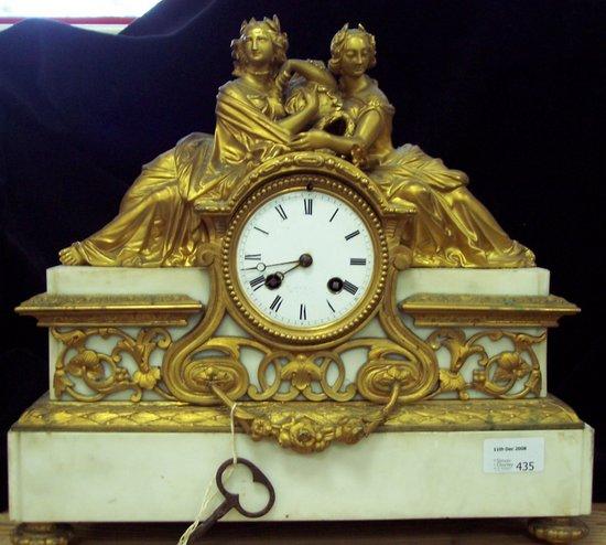 Appraisal: A French mid th Century mantel clock surmounted by two