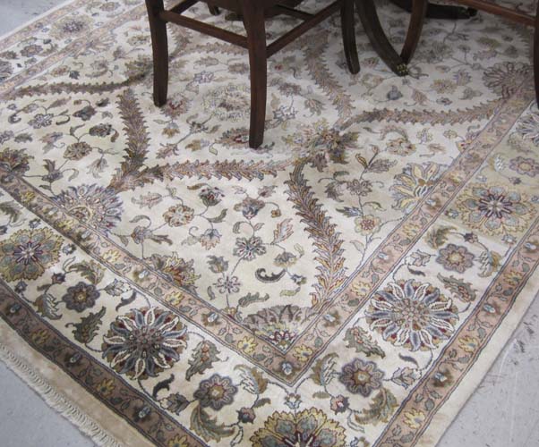 Appraisal: HAND KNOTTED ORIENTAL CARPET Indo-Persian overall floral design on cream