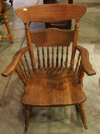 Appraisal: An English oak rocking chair