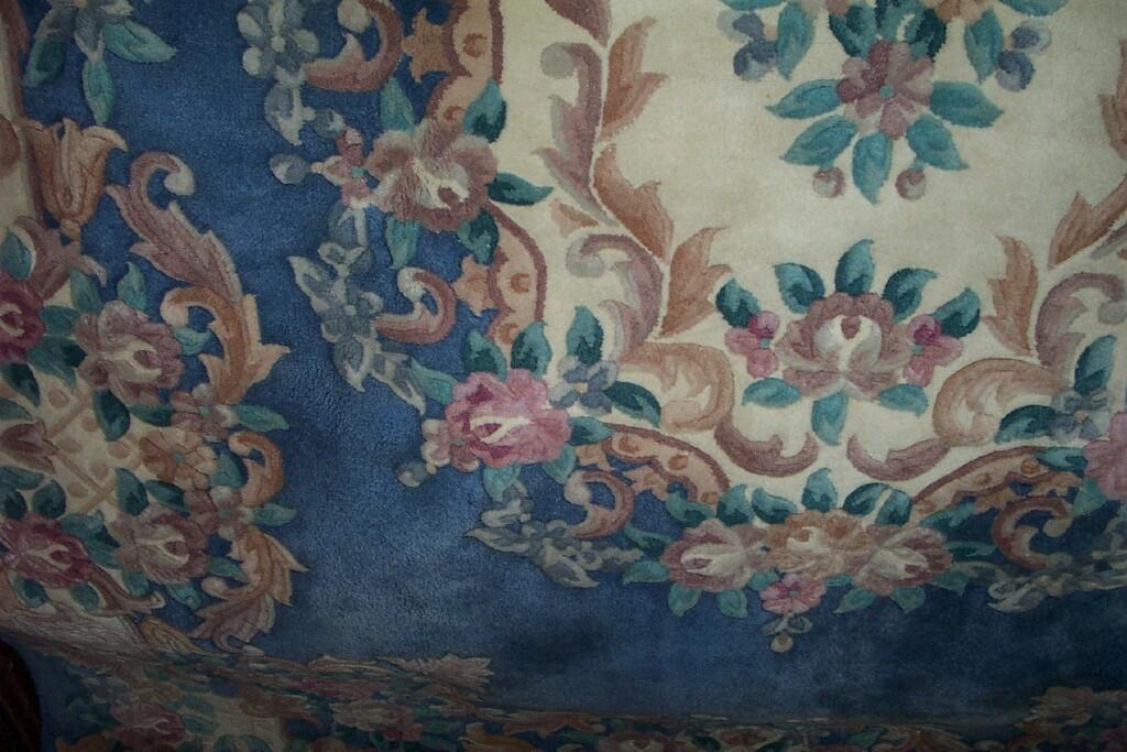 Appraisal: A Chinese blue ground carpet with floral central panel within