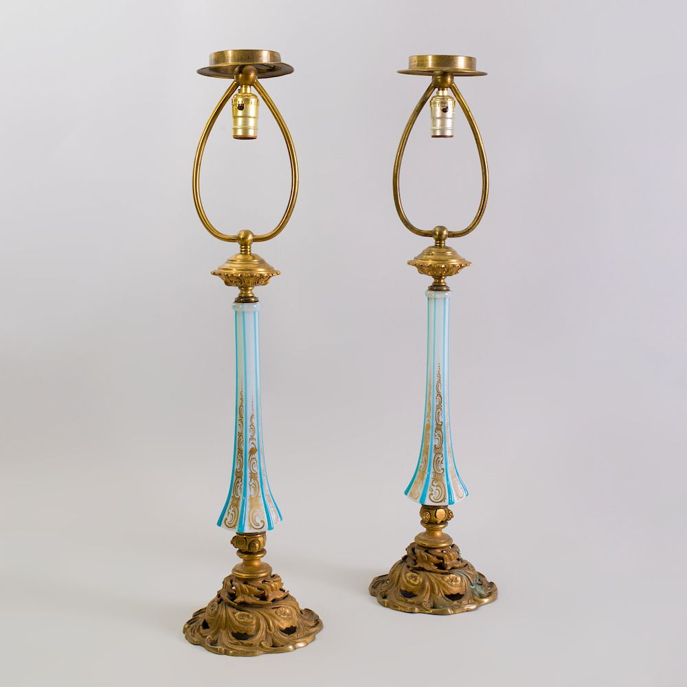 Appraisal: Pair of Gilt-Metal Mounted Overlay Opaline Glass Lamps Of slender