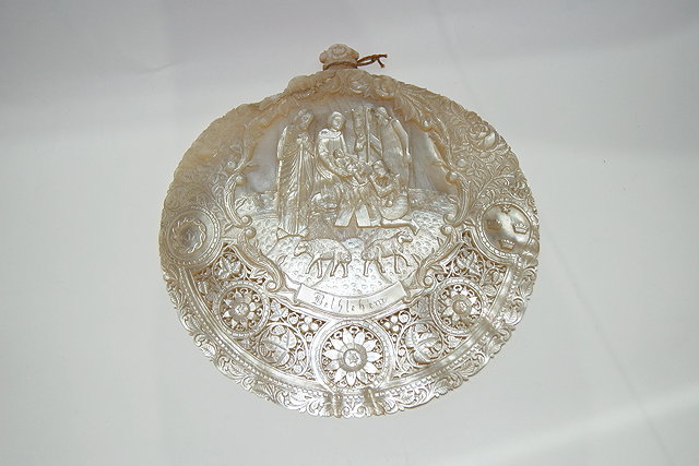 Appraisal: A CARVED MOTHER OF PEARL PLAQUE decorative with a nativity