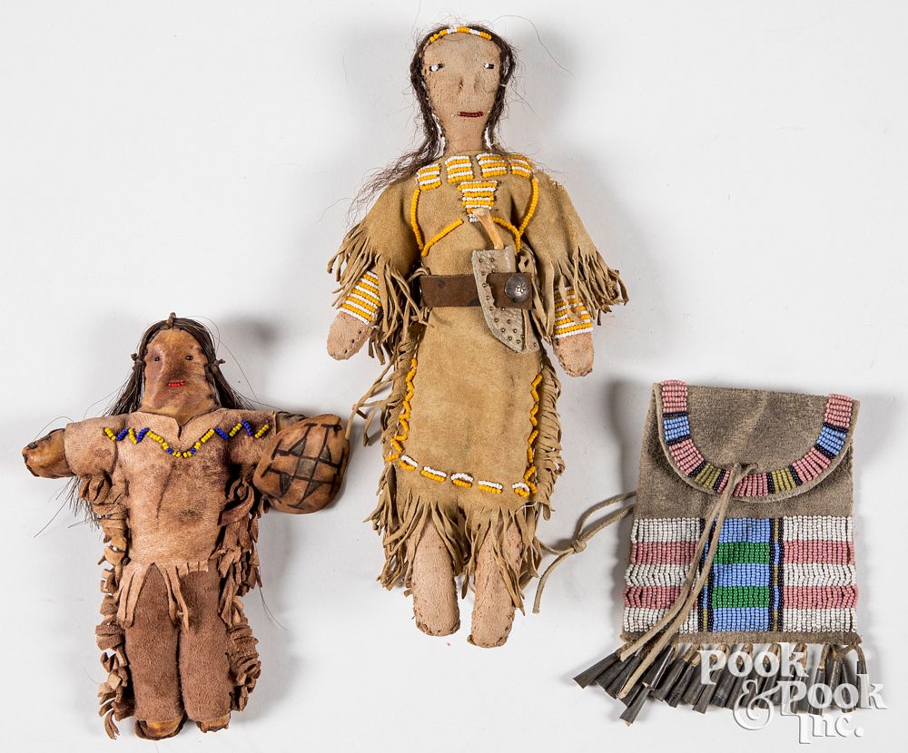 Appraisal: Two Plains Indian style hide dolls Two Plains Indian style