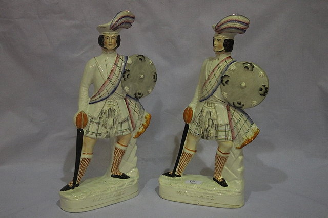 Appraisal: A PAIR OF LARGE STAFFORDSHIRE FIGURES Wallace cm high