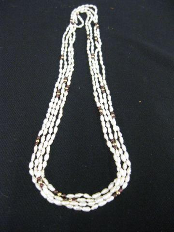 Appraisal: Freshwater Rice Pearl Necklaces garnet gold bead trim each long