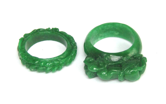 Appraisal: TWO CHINESE CARVED GREEN JADE RINGS together weighing grams Ring