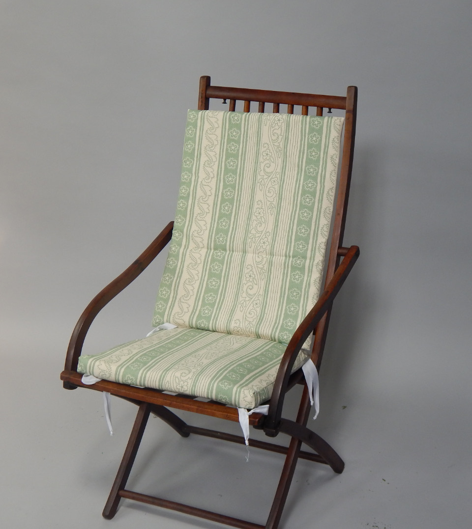 Appraisal: An Edwardian beech and walnut folding deck chair