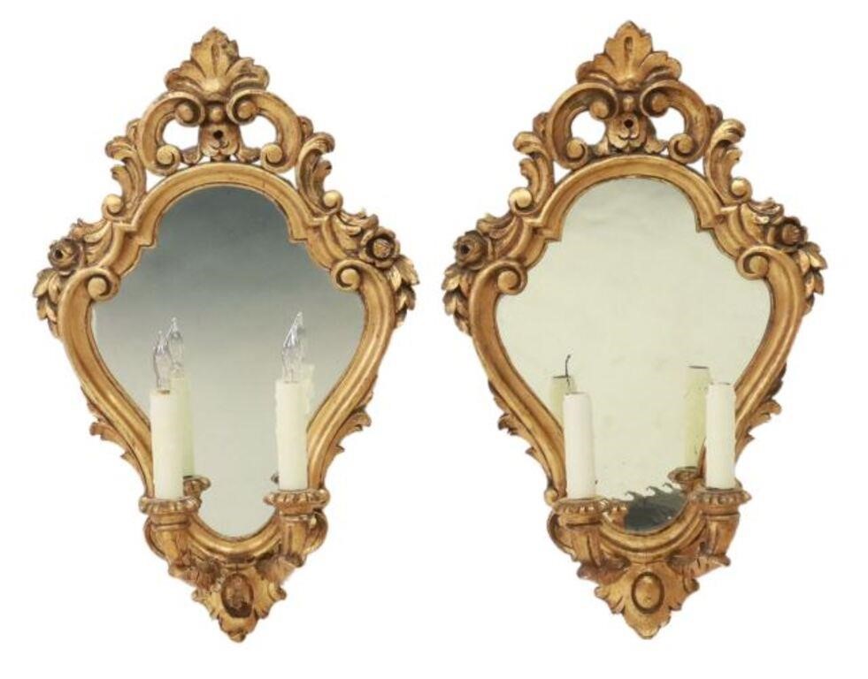 Appraisal: pair Louis XV style mirrored two-light wall sconces shaped giltwood