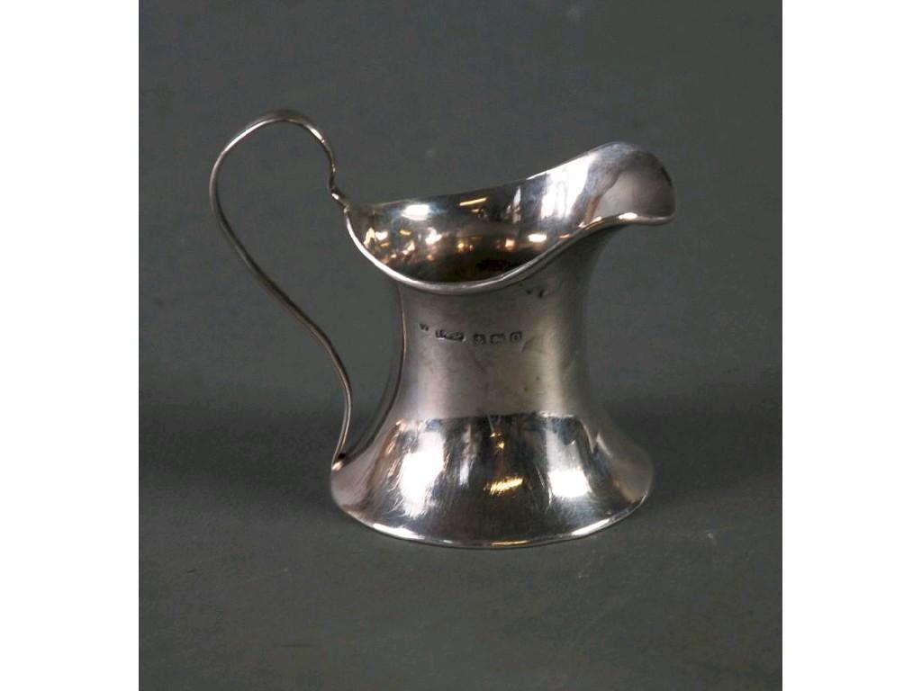 Appraisal: GEORGE V SILVER CREAM JUG waisted form with high scroll