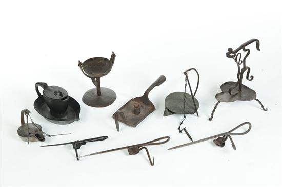 Appraisal: GROUP OF EARLY IRON LIGHTING DEVICES Nineteenth century Includes three