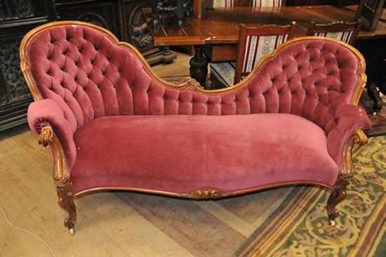 Appraisal: A VICTORIAN WALNUT BUTTON BACK SETTEE IN DUSTY PURPLE VELVET