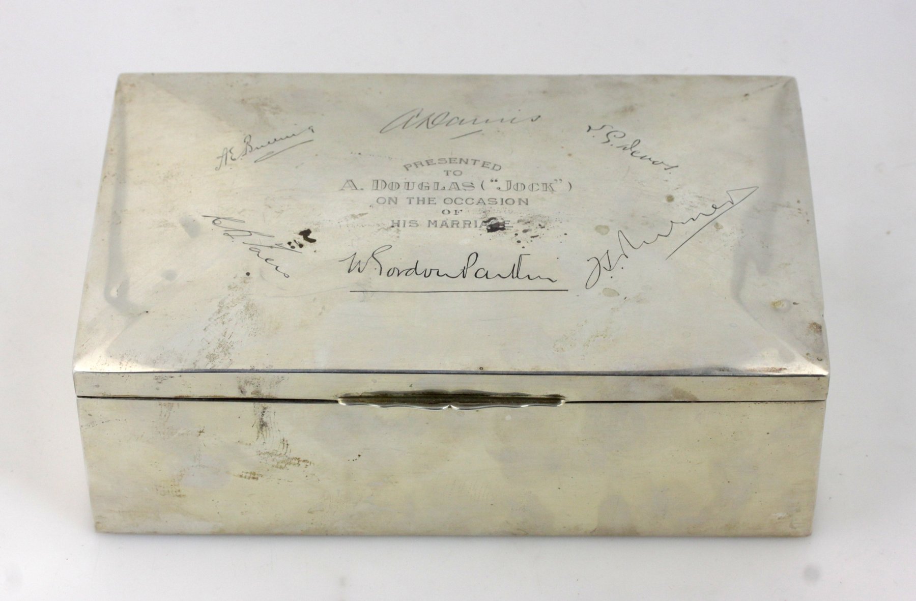 Appraisal: A white metal cigarette box marked Sterling with presentation inscription