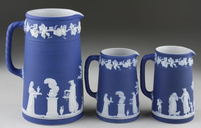 Appraisal: Three Wedgwood Dark Blue Jasperware Pitchers One at and two