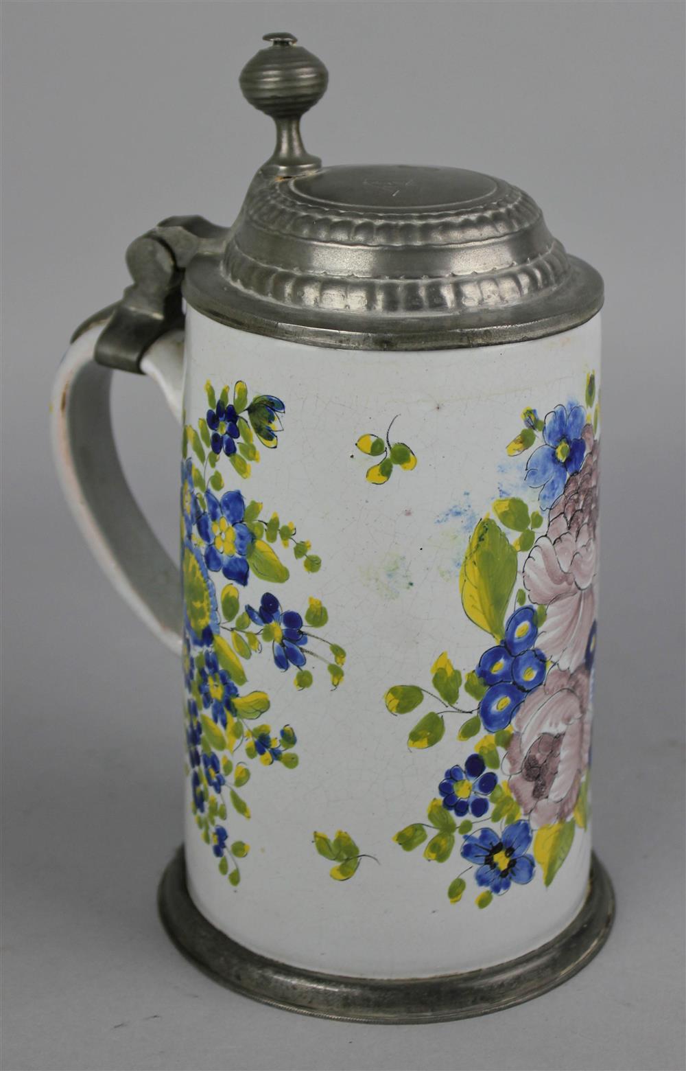 Appraisal: GERMAN PEWTER MOUNTED FAIENCE STEIN th Century possibly Nuremberg decorated